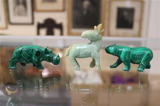 A Chinese soapstone carving of a man holding a jardiniere & other carvings